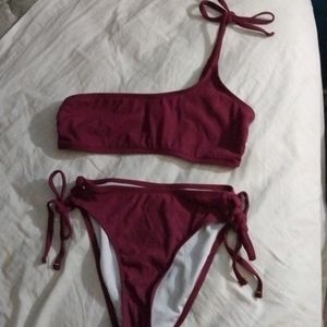 This is a sand castle brand Bikini, size S/P, color is Marron